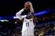 ST LOUIS, MO - MARCH 21: Cleanthony Early #11 of the Wichita State Shockers takes a shot against the Cal Poly Mustangs during the second round of the 2014 NCAA Men's Basketball Tournament at the Scottrade Center on March 21, 2014 in St Louis, Missouri.