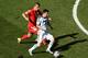 SAO PAULO, BRAZIL - JULY 01: Granit Xhaka of Switzerland challenges Lionel Messi of Argentina during the 2014 FIFA World Cup Brazil Round of 16 match between Argentina and Switzerland at Arena de Sao Paulo on July 1, 2014 in Sao Paulo, Brazil. (Photo by