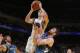 OAKLAND, CA - APRIL 14: Klay Thompson #11 of the Golden State Warriors goes up for the shot against Kevin Love #42 of the Minnesota Timberwolves on April 14, 2014 at Oracle Arena in Oakland, California. NOTE TO USER: User expressly acknowledges and agrees