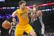 March 19, 2014; Los Angeles, CA, USA; Los Angeles Lakers center Pau Gasol (16) moves to the basket against the San Antonio Spurs during the first half at Staples Center. Mandatory Credit: Gary A. Vasquez-USA TODAY Sports