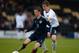 BURTON UPON TRENT, ENGLAND - MAY 26: Matt Targett of England challenges Ryan Gauld of Scotland during the UEFA U19 Championship Elite Qualifying Round Group One match between England U19 and Scotland U19 at the Pirelli Stadium on May 26, 2014 in Burton up