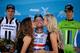 THOUSAND OAKS, CA - MAY 18: Stage winner Mark Cavendish of Great Britain riding for the Omega Pharma-Quickstep Cycling Team is kissed by the flower girls as second and third place finishers, John Degenkolb of Germany riding for Team Giant-Shimano (L) and