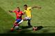BELO HORIZONTE, BRAZIL - JUNE 28: Arturo Vidal of Chile and Luiz Gustavo of Brazil compete for the ball during the 2014 FIFA World Cup Brazil round of 16 match between Brazil and Chile at Estadio Mineirao on June 28, 2014 in Belo Horizonte, Brazil. (Pho