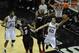 Jun 15, 2014; San Antonio, TX, USA; San Antonio Spurs guard Manu Ginobili (20) shoots against Miami Heat forward Chris Bosh (1) in game five of the 2014 NBA Finals at AT&T Center. Mandatory Credit: Brendan Maloney-USA TODAY Sports