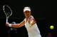 LONDON, ENGLAND - JULY 02: Eugenie Bouchard of Canada plays a forehand return during her Ladies' Singles quarter-final match against Angelique Kerber of Germany on day nine of the Wimbledon Lawn Tennis Championships at the All England Lawn Tennis and Cro