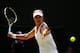 LONDON, ENGLAND - JULY 02: Eugenie Bouchard of Canada plays a forehand return during her Ladies' Singles quarter-final match against Angelique Kerber of Germany on day nine of the Wimbledon Lawn Tennis Championships at the All England Lawn Tennis and Cro