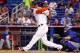 MIAMI, FL - JUNE 18: Giancarlo Stanton #27 of the Miami Marlins hits a home run during the first inning of the game against the Chicago Cubs at Marlins Park on June 18, 2014 in Miami, Florida. (Photo by Rob Foldy/Getty Images)