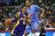 April 6, 2014; Los Angeles, CA, USA; Los Angeles Lakers guard Kent Bazemore (6) moves the ball against Los Angeles Clippers forward Matt Barnes (22) during the first half at Staples Center. Mandatory Credit: Gary A. Vasquez-USA TODAY Sports