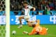 PORTO ALEGRE, BRAZIL - JUNE 30: Thomas Mueller of Germany attempts a shot against Rais M'Bolhi of Algeria during the 2014 FIFA World Cup Brazil Round of 16 match between Germany and Algeria at Estadio Beira-Rio on June 30, 2014 in Porto Alegre, Brazil. (