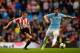 MANCHESTER, ENGLAND - APRIL 16: Lee Cattermole of Sunderland and Alvaro Negredo of Manchester City compete for the ball during the Barclays Premier League match between Manchester City and Sunderland at Etihad Stadium on April 16, 2014 in Manchester, Engl