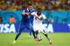 RECIFE, BRAZIL - JUNE 29: Joel Campbell of Costa Rica controls the ball against Andreas Samaris of Greece during the 2014 FIFA World Cup Brazil Round of 16 match between Costa Rica and Greece at Arena Pernambuco on June 29, 2014 in Recife, Brazil. (Photo
