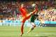 FORTALEZA, BRAZIL - JUNE 29: Robin van Persie of the Netherlands reaches for the ball during the 2014 FIFA World Cup Brazil Round of 16 match between Netherlands and Mexico at Castelao on June 29, 2014 in Fortaleza, Brazil. (Photo by Robert Cianflone/Get