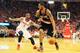 HOUSTON, TX - APRIL 23: LaMarcus Aldridge #12 of the Portland Trail Blazers drives with the ball against Terrence Jones #6 of the Houston Rockets during the second half in Game Two of the Western Conference Quarterfinals during the 2014 NBA Playoffs at