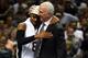 SAN ANTONIO, TX - JUNE 15: Gregg Popovich celebrates with Patty Mills #8 of the San Antonio Spurs after defeating the Miami Heat in Game Five of the 2014 NBA Finals at the AT&T Center on June 15, 2014 in San Antonio, Texas. NOTE TO USER: User expressly ac