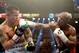 LAS VEGAS, NV - MAY 03: (R-L) Floyd Mayweather Jr. knocks back Marcos Maidana during their WBC/WBA welterweight unification fight at the MGM Grand Garden Arena on May 3, 2014 in Las Vegas, Nevada. Mayweather took Maidana's title with a majority-decision