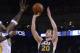 Apr 6, 2014; Oakland, CA, USA; Utah Jazz guard Gordon Hayward (20) shoots the ball against the Golden State Warriors during the third quarter at Oracle Arena. The Warriors defeated the Jazz 130-102. Mandatory Credit: Kyle Terada-USA TODAY Sports