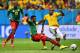 BRASILIA, BRAZIL - JUNE 23: Fernandinho of Brazil scores his team's fourth goal against Nicolas N'Koulou of Cameroon during the 2014 FIFA World Cup Brazil Group A match between Cameroon and Brazil at Estadio Nacional on June 23, 2014 in Brasilia, Brazil.