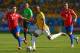 BELO HORIZONTE, BRAZIL - JUNE 28: Fernandinho of Brazil controls the ball against Charles Aranguiz of Chile during the 2014 FIFA World Cup Brazil round of 16 match between Brazil and Chile at Estadio Mineirao on June 28, 2014 in Belo Horizonte, Brazil. (