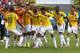 CUIABA, BRAZIL - JUNE 24: Juan Guillermo Cuadrado of Colombia celebrates with teammates scoring his team's first goal after a penalty kick during the 2014 FIFA World Cup Brazil Group C match between Japan and Colombia at Arena Pantanal on June 24, 2014 i