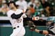HOUSTON, TX - JULY 02: Jose Altuve #27 of the Houston Astros strikes out in the first inning as catcher John Buck #4 of the Seattle Mariners catches the ball at Minute Maid Park on July 2, 2014 in Houston, Texas. (Photo by Bob Levey/Getty Images)