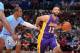 LOS ANGELES, CA - APRIL 6: Kendall Marshall #12 of the Los Angeles Lakers dribbles against Chris Paul #3 of the Los Angeles Clippers at Staples Center on April 6, 2014 in Los Angeles, California. NOTE TO USER: User expressly acknowledges and agrees that,