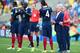 RIO DE JANEIRO, BRAZIL - JULY 04: Head coach Didier Deschamps of France (2nd R) speaks to players on the sideline during the 2014 FIFA World Cup Brazil Quarter Final match between France and Germany at Maracana on July 4, 2014 in Rio de Janeiro, Brazil.