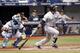 ST. PETERSBURG, FL - JUNE 9: Catcher Jose Molina #28 of the Tampa Bay Rays looks on as Robinson Cano #22 of the Seattle Mariners hits a two-run single during the third inning of a game on June 9, 2014 at Tropicana Field in St. Petersburg, Florida. (Phot