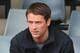 MELBOURNE, AUSTRALIA - NOVEMBER 03: Former footballer Michael Owen looks on as the horse he owns, Brown Panther gallops during trackwork ahead of the Melbourne Cup at Werribee Racecourse on November 3, 2013 in Melbourne, Australia. (Photo by Scott Barbo