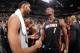SAN ANTONIO, TX - JUNE 15: Tim Duncan #21 of the San Antonio Spurs and Chris Bosh #1 of the Miami Heat shake hands after the San Antonio Spurs' victory in Game Five and winning the 2014 NBA Finals between the Miami Heat and San Antonio Spurs at AT&T Cente