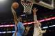 Mar 9, 2014; Los Angeles, CA, USA; Oklahoma City Thunder center Hasheem Thabeet (34) shoots over Los Angeles Lakers center Pau Gasol (16) during the first half at Staples Center. Mandatory Credit: Richard Mackson-USA TODAY Sports