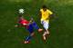 BELO HORIZONTE, BRAZIL - JUNE 28: Arturo Vidal of Chile and Luiz Gustavo of Brazil compete for the ball during the 2014 FIFA World Cup Brazil round of 16 match between Brazil and Chile at Estadio Mineirao on June 28, 2014 in Belo Horizonte, Brazil. (Pho