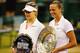 LONDON, ENGLAND - JULY 05: Petra Kvitova of Czech Republic poses with the Venus Rosewater Dish trophy next to Eugenie Bouchard of Canada and her runner-up trophy after their Ladies' Singles final match on day twelve of the Wimbledon Lawn Tennis Champions