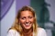 LONDON, ENGLAND - JULY 05: Petra Kvitova of Czech Republic smiles as she speaks to members of the media at a press conference following her victory in the Ladies' Singles final match against Eugenie Bouchard of Canada on day twelve of the Wimbledon Lawn