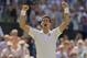 Jul 4, 2014; London, United Kingdom; Novak Djokovic (SRB) celebrates recording match point in his match against Grigor Dimitrov (BUL) on day 11 of the 2014 Wimbledon Championships at the All England Lawn and Tennis Club. Mandatory Credit: Susan Mullane-US