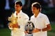 LONDON, ENGLAND - JULY 06: Novak Djokovic of Serbia poses with the Gentlemen's Singles Trophy next to Roger Federer of Switzerland following his victory in the Gentlemen's Singles Final match on day thirteen of the Wimbledon Lawn Tennis Championships at