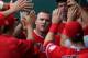 KANSAS CITY, MO - JUNE 29: Mike Trout #27 of the Los Angeles Angels of Anaheim celebrates with teammates after scoring in the first inning during a game against the Kansas City Royals at Kauffman Stadium on June 29, 2014 in Kansas City, Missouri. (Photo