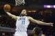 Mar 22, 2014; Charlotte, NC, USA; Charlotte Bobcats forward Josh McRoberts (11) goes up for a dunk against the Portland Trail Blazers in the second half at Time Warner Cable Arena. The Bobcats defeated the Trail Blazers 124-94. Mandatory Credit: Jeremy Br