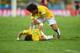 FORTALEZA, BRAZIL - JULY 04: Neymar of Brazil lies on the field after a challenge as teammate Marcelo reacts during the 2014 FIFA World Cup Brazil Quarter Final match between Brazil and Colombia at Castelao on July 4, 2014 in Fortaleza, Brazil. (Photo b