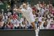 Jul 6, 2014; London, United Kingdom; Roger Federer (SUI) in action during his match against Novak Djokovic (SRB) on day 13 of the 2014 Wimbledon Championships at the All England Lawn and Tennis Club. Mandatory Credit: Susan Mullane-USA TODAY Sports