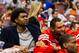 Oct 17, 2012; Philadelphia, PA, USA; Philadelphia 76ers center Andrew Bynum (33) (in street cloths) sits next to center Dan Gadzuric (14) at the end of the bench during the third quarter against the Cleveland Cavaliers at the Wachovia Center. The Sixers d