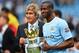 MANCHESTER, ENGLAND - MAY 11: The Manchester City Manager Manuel Pellegrini and Yaya Toure pose with the trophy at the end of the Barclays Premier League match between Manchester City and West Ham United at the Etihad Stadium on May 11, 2014 in Mancheste