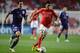 LISBON, PORTUGAL - SEPTEMBER 17: Enzo Perez (R) of SL Benfica takes the ball past Sacha Kljestan of RSC Anderlecht during the UEFA Champions League group stage match between SL Benfica and RSC Anderlecht held on September 17, 2013 at the Estadio do Sport