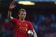 LIVERPOOL, ENGLAND - MAY 19: Lucas of Liverpool waves to the fans with his son Pedro Leiva after the Barclays Premier League match between Liverpool and Queens Park Rangers at Anfield on May 19, 2013 in Liverpool, England. (Photo by Julian Finney/Getty