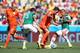 FORTALEZA, BRAZIL - JUNE 29: Robin van Persie of the Netherlands is challenged by Diego Reyes (2nd L) and Carlos Salcido of Mexico during the 2014 FIFA World Cup Brazil Round of 16 match between Netherlands and Mexico at Castelao on June 29, 2014 in Fort