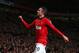 MANCHESTER, ENGLAND - MAY 06: Robin van Persie of Manchester United celebrates scoring his team's third goal during the Barclays Premier League match between Manchester United and Hull City at Old Trafford on May 6, 2014 in Manchester, England. (Photo b