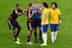 BELO HORIZONTE, BRAZIL - JULY 08: Referee Marco Rodriguez separates a clash between Jerome Boateng and Thomas Mueller of Germany and David Luiz and Marcelo of Brazil during the 2014 FIFA World Cup Brazil Semi Final match between Brazil and Germany at Est
