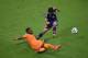 RECIFE, BRAZIL - JUNE 14: Hotaru Yamaguchi of Japan tries to clear the ball past Serge Aurier of the Ivory Coast during the 2014 FIFA World Cup Brazil Group C match between the Ivory Coast and Japan at Arena Pernambuco on June 14, 2014 in Recife, Brazil.