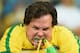 BELO HORIZONTE, BRAZIL - JULY 08: An emotional Brazil fan reacts after being defeated by Germany 7-1 during the 2014 FIFA World Cup Brazil Semi Final match between Brazil and Germany at Estadio Mineirao on July 8, 2014 in Belo Horizonte, Brazil. (Photo b