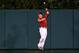 ANAHEIM, CA - JUNE 24: Center fielder Mike Trout #27 of the Los Angeles Angels of Anaheim makes a leaping catch on a deep fly ball hit by Eduardo Escobar of the Minnesota Twins to end the Twins' eighth inning at Angel Stadium of Anaheim on June 24, 2014