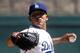 Mar 15, 2014; Phoenix, AZ, USA; Los Angeles Dodgers pitcher Julio Urias (84) throws in the first inning against the San Diego Padres at Camelback Ranch. Mandatory Credit: Rick Scuteri-USA TODAY Sports
